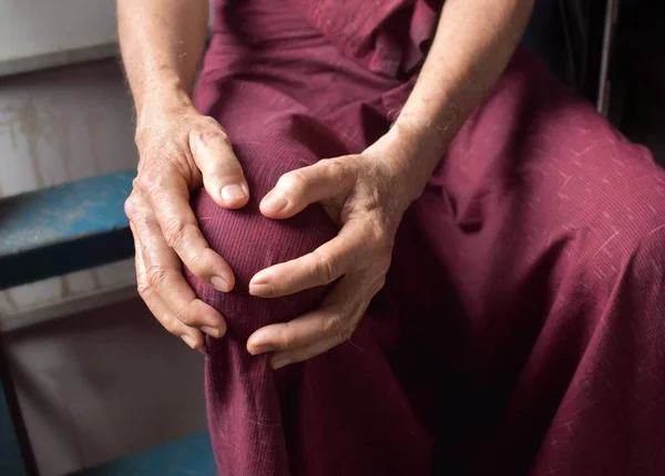 Knee joint pain in Asian Myanmar elder man. Concept of osteoarthritis, rheumatoid arthritis, patellar tendonitis, prepatellar bursitis, collateral ligament injury or baker cyst.