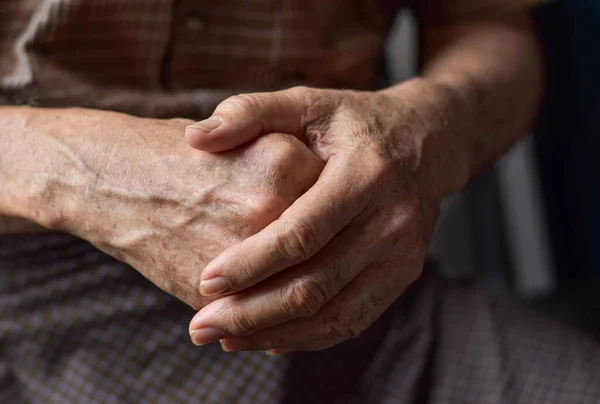 Hand of Southeast Asian elder man. Concept of rheumatoid arthritis, osteoarthritis, or joint pain.