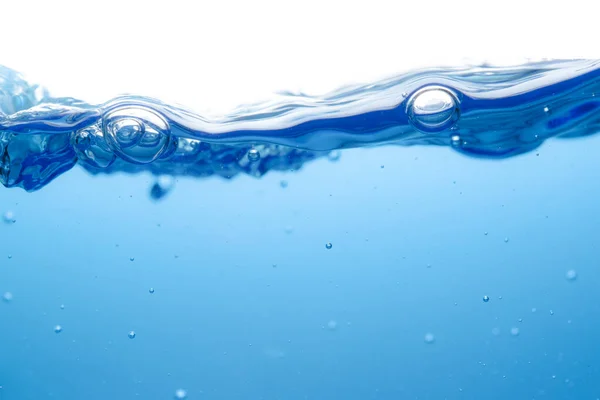 Small bubbles above the water surface, clean blue, refreshing movement, white background, macro