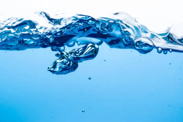 Close-up to the surface of the water with clean, pure blue circles Refreshing and white background. Macro