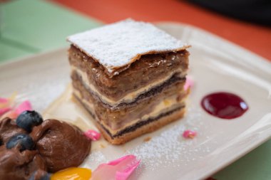 Prekmurska Gibanica (Prekmurje layer pastry) is a type of Slovenian gibanica or layered pastry. It contains poppy seeds, walnuts, apples, raisins and quark fillings