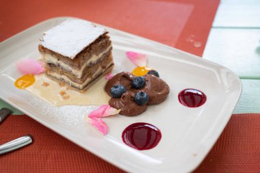 Prekmurska Gibanica (Prekmurje layer pastry) is a type of Slovenian gibanica or layered pastry. It contains poppy seeds, walnuts, apples, raisins and quark fillings