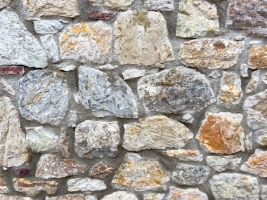 Taş duvar dokusu. Kopya alanı olan eski kayalık el yapımı arka plan. Doğal tuğlalardan yapılmış duvarlar. Yüksek kalite fotoğraf. Ev ve ofis tasarımı arkaplanı