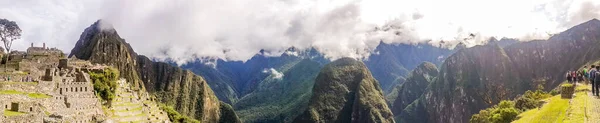 Panoramic view of Machu Piccu on cloudy day early. High angle view. Natural and historical background with copy space. Machu Picchu is an Incan citadel set high in Andes Mountains in Peru