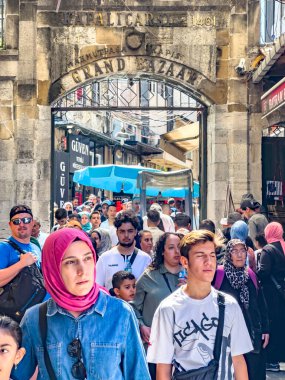 Istanbul, Turkey, 07.14.2022: Grand Bazaar Mahmutpasa Gate Entrance with massive tourist crowds. The largest, oldest covered market in the world. Over 4000 shops, attracting thousand visitors daily