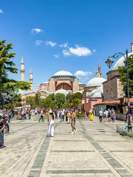 Istanbul - Turkey - July 14, 2022: The magnificent and beautiful Hagia Sophia church, museum, mosque visited by international tourist crowds, taking pictures. Bright colorful sunny day. Historical