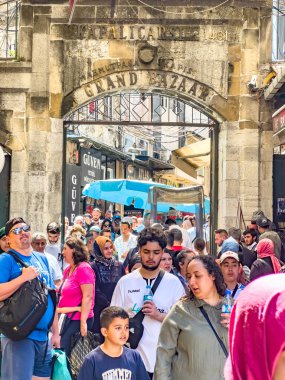 Istanbul, Turkey, 07.14.2022: Grand Bazaar Mahmutpasa Gate Entrance with massive tourist crowds. The largest, oldest covered market in the world. Over 4000 shops, attracting thousand visitors daily