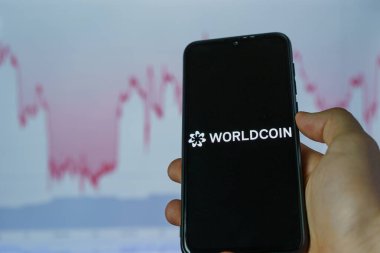 Dünya para kriptosu. Worldcoin, dünyadaki her insana bir parça vererek piyasaya sürülen dijital para birimidir..