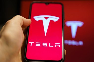 Tesla Model Pi smartphone. Phone made by Elon Musk company Tesla. Tesla logo on smartphone screen