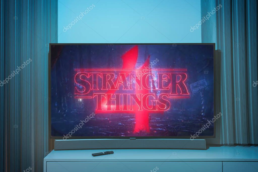 Stranger Thins season 4 TV series on big tv screen. Stranger things television show at home