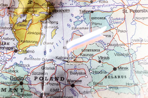 Kaliningrad on geopolitical map with Russian flag. Kaliningrad is the capital of the Russian province of the same name, sandwiched between Poland and Lithuania along the Baltic Coast