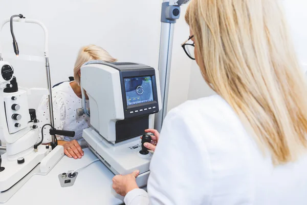 Eye doctor checking vision with modern equipment. Eye examination. High quality photo