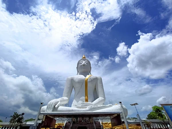 White Big Buddha Landscape, Rai Khing Temple in Thailand, towering and beautiful with bright sky background, religious cultural attraction.