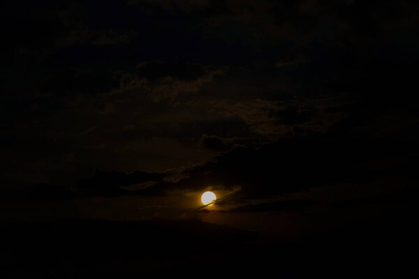 Fully moon and clouds in the summer