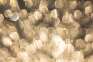 Bokeh odaklanmış ışıklarla soyut arkaplan.