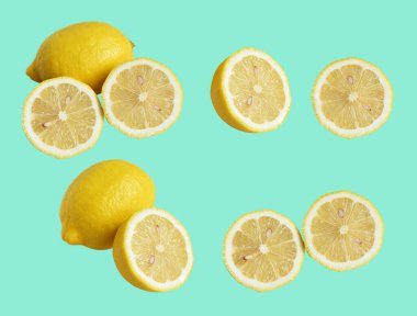 Kesme yolu ile izole edilmiş taze sarı limon meyvesi, gölge yok, parçalar, yarısı, yeşil arka planda dilimler