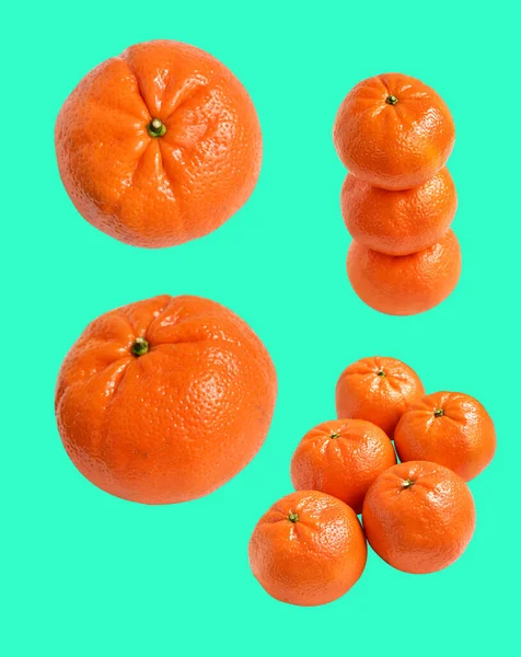 Mandarin orange isolated with clipping path in green background, no shadow, healthy fruit