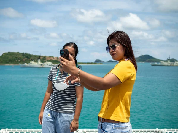 Woman Yellow Shirt Holding Phone Take Selfie Girl Gray Shirt — Foto de Stock