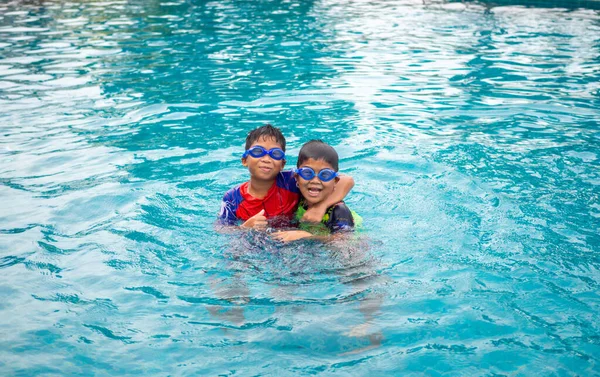 Brothers Wear Swimsuit Goggles Smile Enjoy Playing Water Blue Pool —  Fotos de Stock