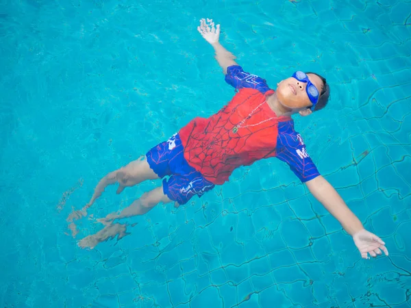 Boy Wearing Swimsuit Glasses Swimming Middle Pool Blue Water Background — Foto Stock