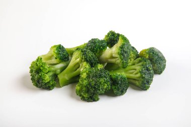 Frozen green broccoli  on a white. Handmade clipping path.