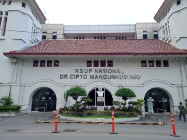 Editorial Photo, Indonesia, 12 December 2021, Central Jakarta, RSCM Hospital Cipto Mangunkusumo, CiptoMangunkusumo, and some people Passing by 