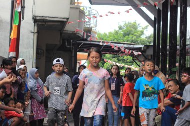 editorial photo, indonesia, 17 august 2022, east jakarta fun game at hut ri, kemerdekaan, bring marble at Spoon