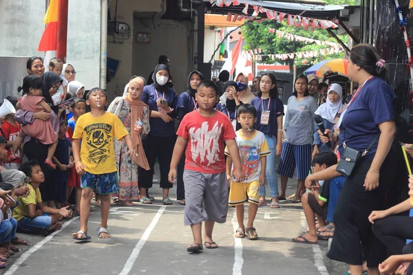 editorial photo, indonesia, 17 august 2022, east jakarta fun game at hut ri, kemerdekaan, bring marble at Spoon