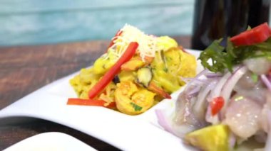 Sea trio, ceviche and chicharrn de pescado. Chicha morada. Peruvian food.