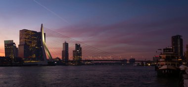 Morning view of the Skyline of Rotterdam and the Erasmus Bridge, seen from the Maas (Meuse), the Netherlands. December 22, 2021.
