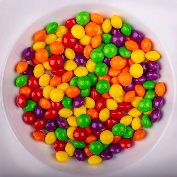 Top View Pile Colorful Shiny Skittles White Bowl — Stockfoto