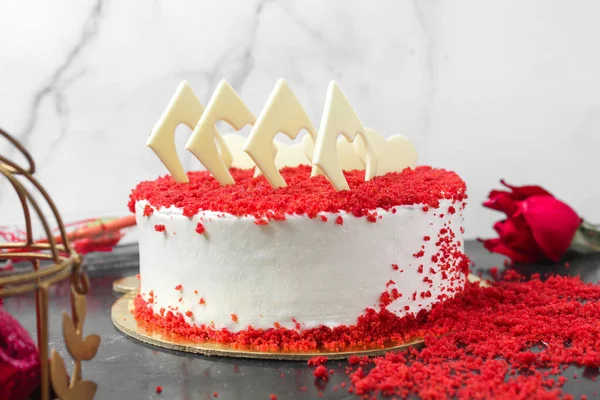 Red velvet cake, classic three layered cake from red butter sponge cakes with cream cheese frosting