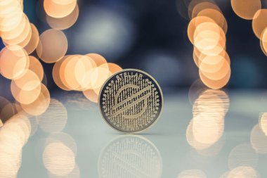 Bir Altın Yıldız Lumen (XLM) madeni para, Bokeh Arkaplanı