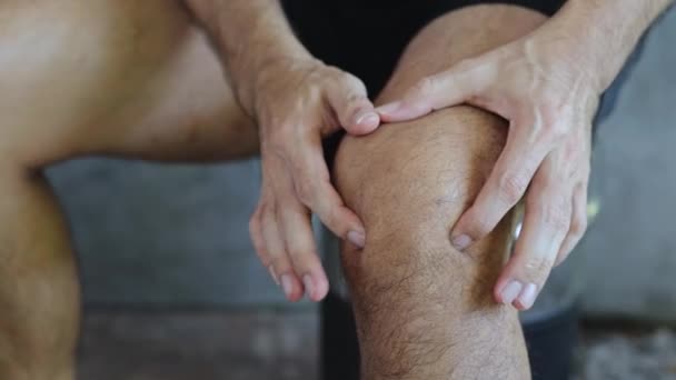 Close Man Massages His Knee Pain — Stock Video