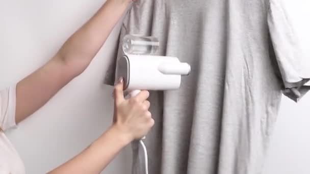 Woman Steaming Gray Shirt Manual Steamer — Stock Video