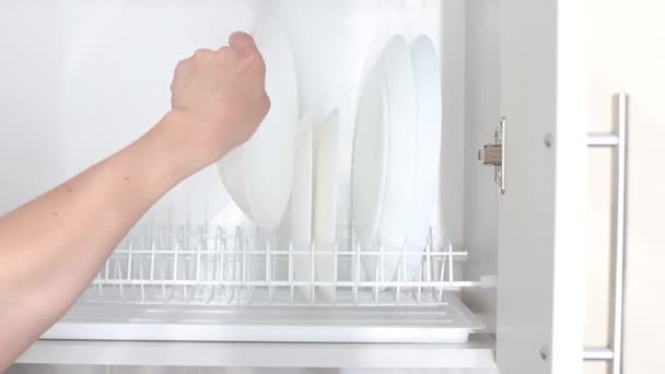 Woman Puts Empty Dishes Shelf Kitchen Close — Stok video