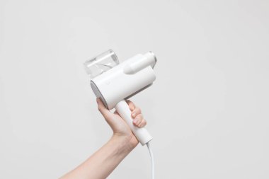 Elde taşınabilir elbise buharlı tenceresi. çamaşırhane