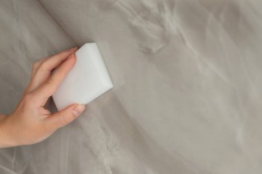 wash the tiles with a white sponge. close-up