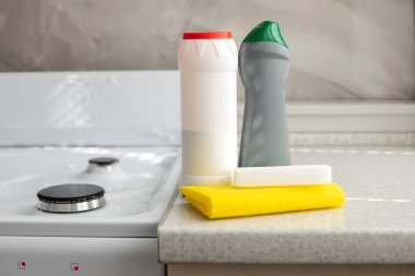 means for cleaning the house on the kitchen table. Cleaning