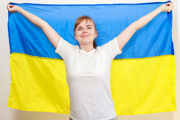 a woman with the flag of Ukraine. close-up