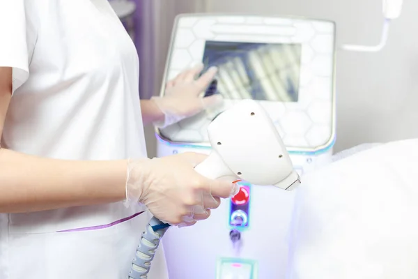diode laser in the hands of a beautician close-up