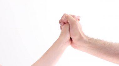 the hand of a man and a woman are connected on a white background. love and separation
