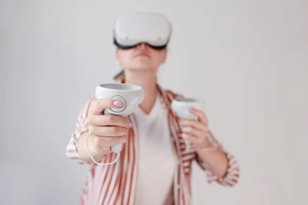 woman in virtual reality glasses on a white background. virtual.oculuses