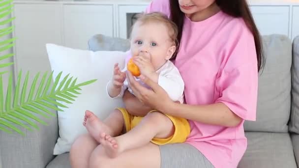 Close Baby Smiles Arms Mother Nibbles Toy — Stock videók