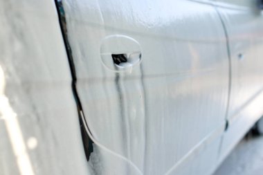 machine in foam for washing at the sink