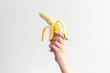 banana in a condom on a white background