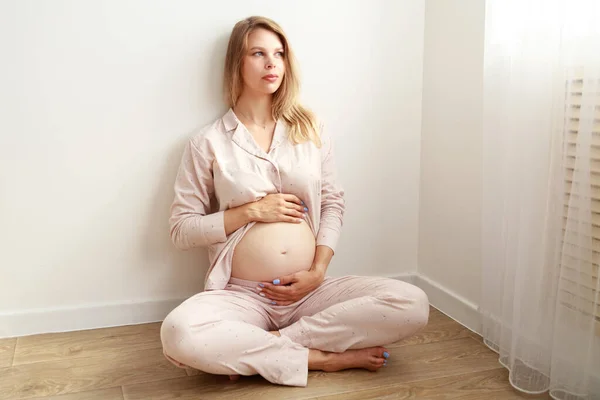 Pregnant Woman Strokes Her Belly While Sitting Floor Home Motherhood — Stock Fotó