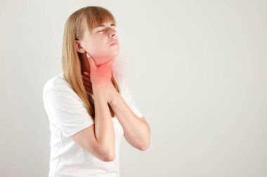 a woman has a sore throat. allergy, sore throat, viral disease, cold