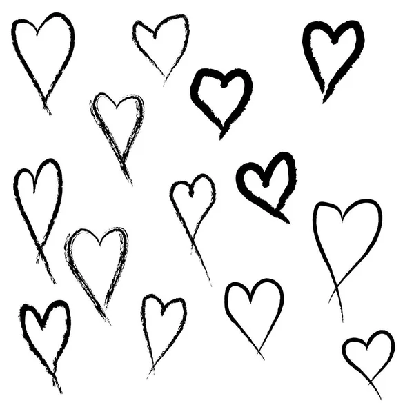 Beyaz arka planda fırçayla çizilmiş rastgele bir kalp seti.