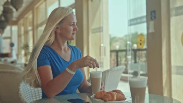 Blonde Woman Sitting Cafe Drinking Coffee Talking Phone — Stockvideo